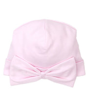 Load image into Gallery viewer, Pink baby hat with a bow on a white background
