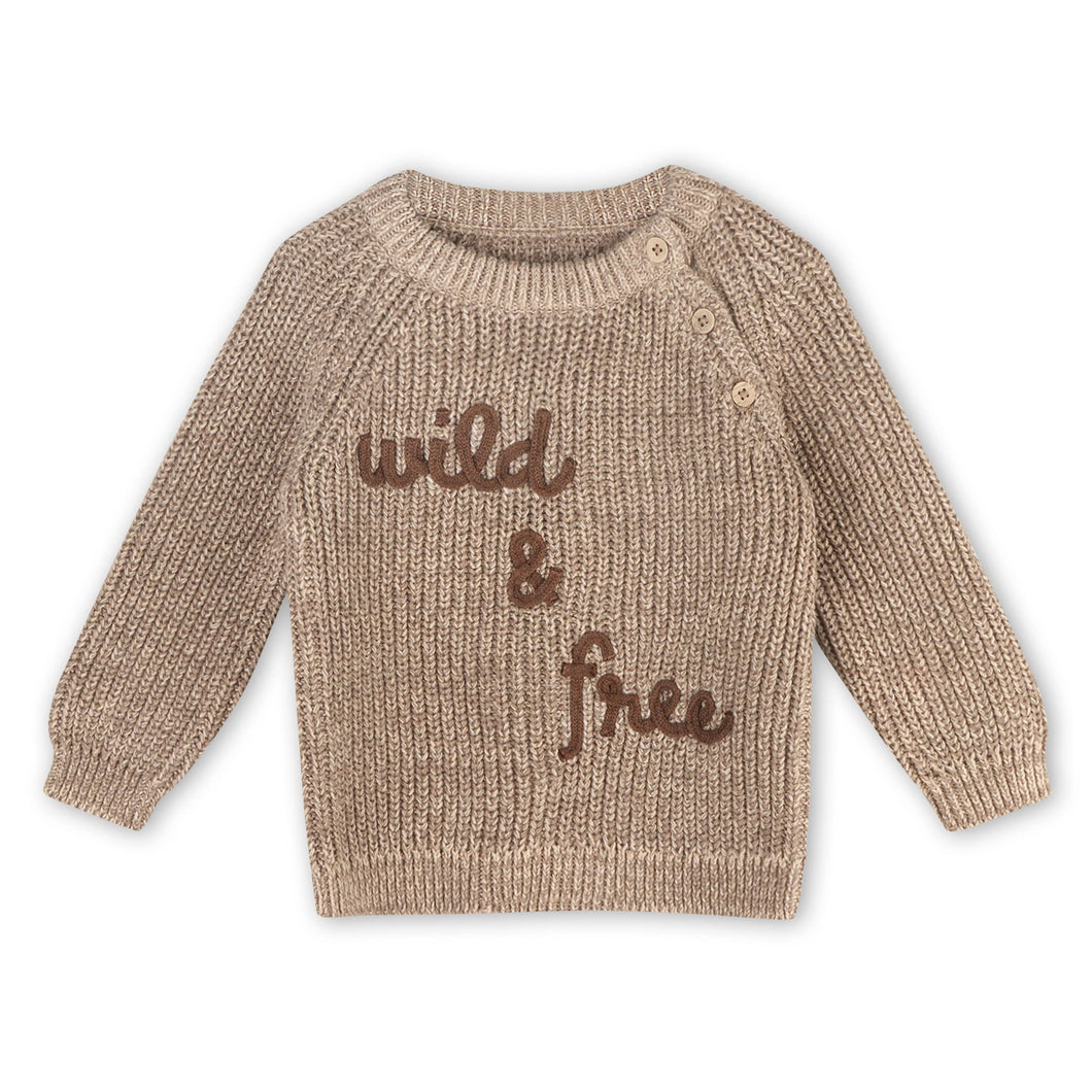 Beige knitted sweater with 'wild and free' text on front