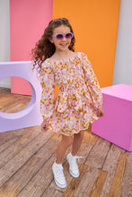 Load image into Gallery viewer, Young girl in a top and skirt standing in front of colorful geometric shapes on a wooden floor.
