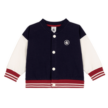 Load image into Gallery viewer, Navy and white varsity jacket with red accents on a white background
