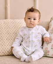 Load image into Gallery viewer, Baby wearing a farm print footie sitting on a patterned couch.

