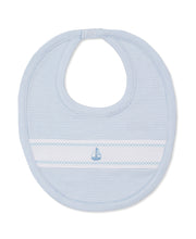 Load image into Gallery viewer, Baby bib with nautical design on a white background
