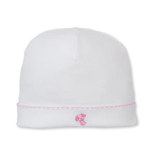Load image into Gallery viewer, White baby hat with pink trim and puppy embrodery on a white background

