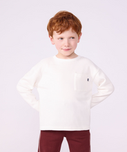 Load image into Gallery viewer, A young boy with red hair wearing a white long-sleeve crewneck sweatshirt with a chest pocket and small pb logo
