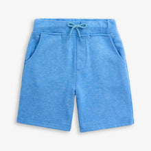 Load image into Gallery viewer, Blue shorts with a drawstring on a white background
