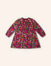 Load image into Gallery viewer, A long-sleeve children's dress with a dense, colorful floral print. featuring a gathered round neckline and a flared silhouette.
