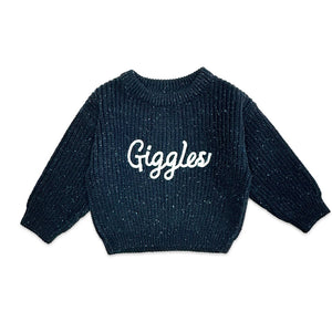Navy blue sweater with 'Giggles' text on a white background